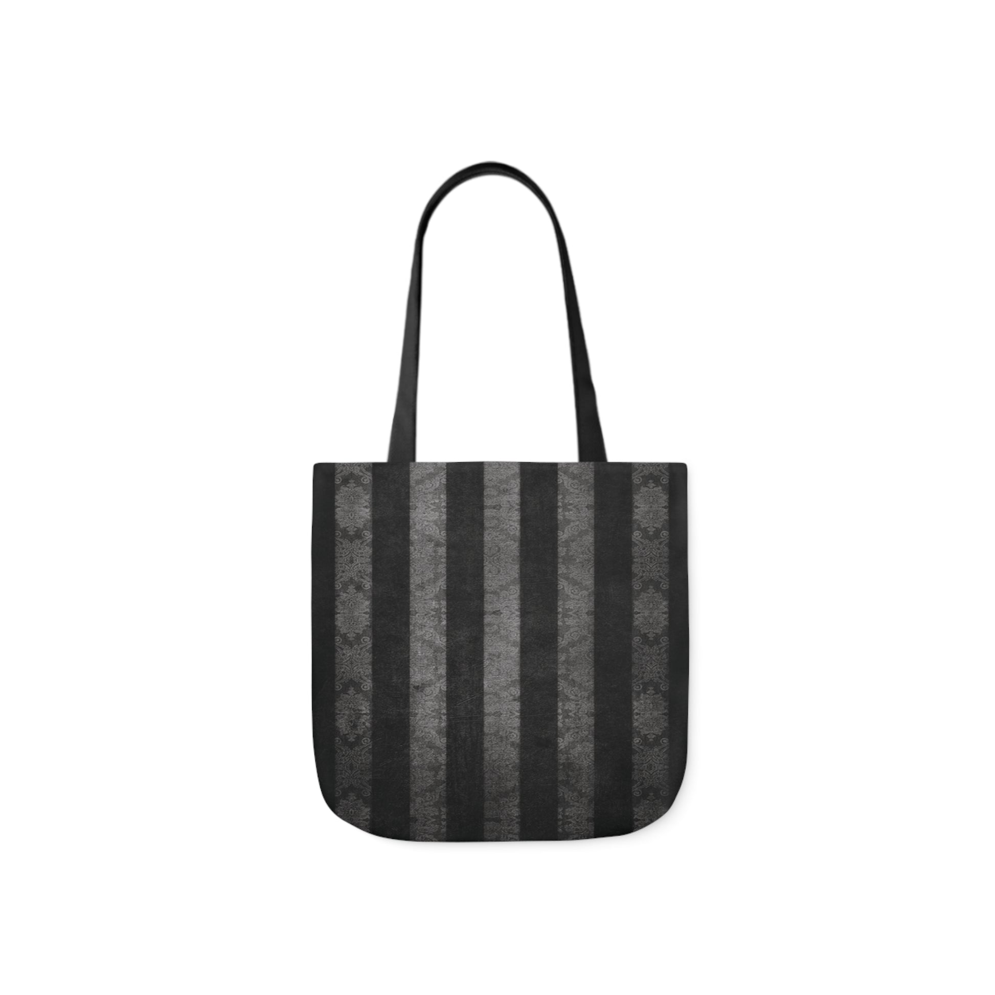 A canvas shoulder tote bag with a design of vintage damask black and grey stripes. The design looks distressed.