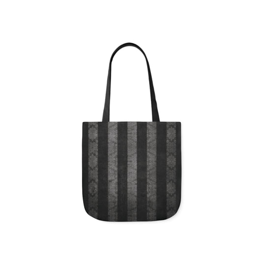 A canvas shoulder tote bag with a design of vintage damask black and grey stripes. The design looks distressed.