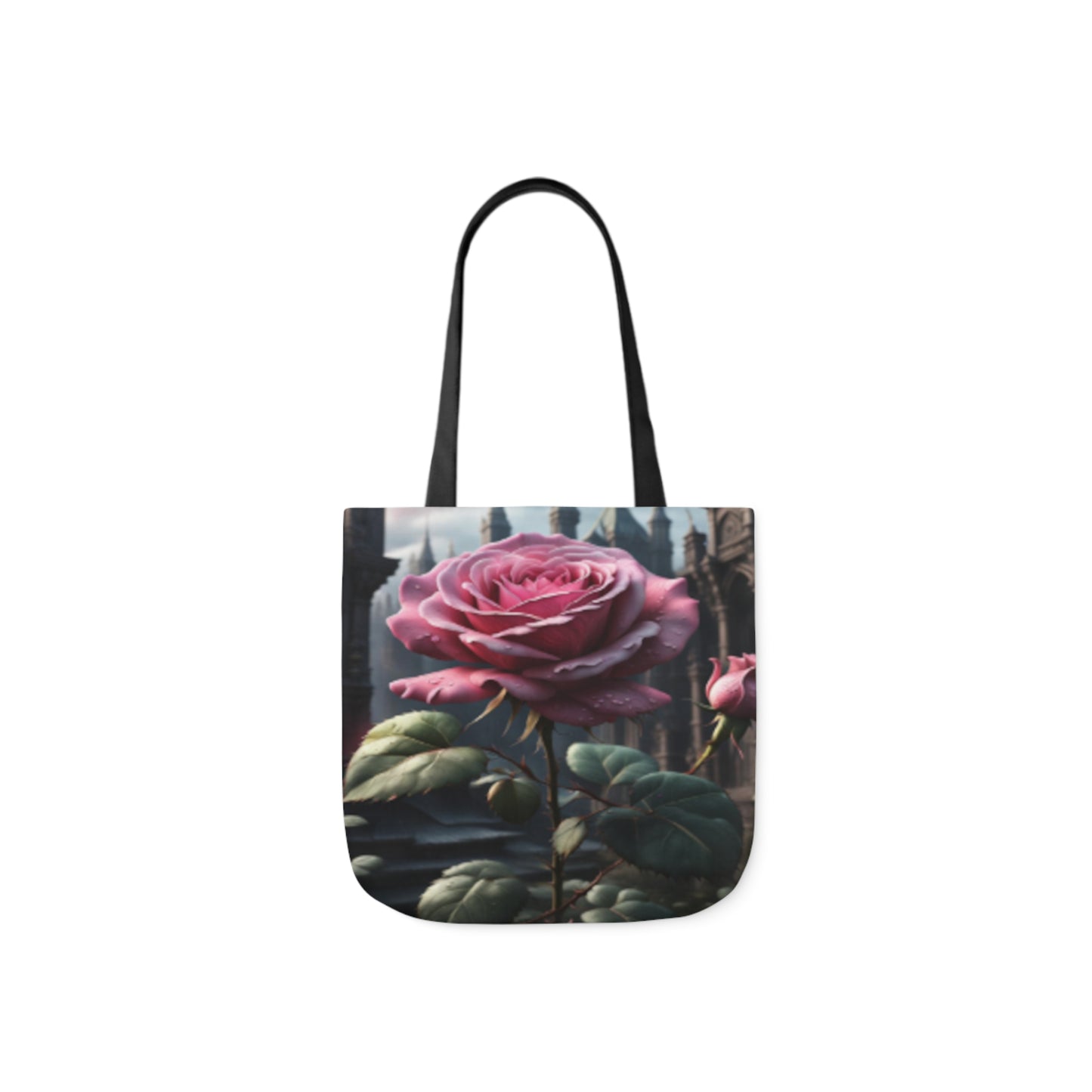 A canvas shoulder tote bag with a design of a pink rose in a fantasy castle garden. The bag handles are black.