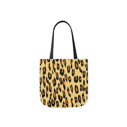 A canvas shoulder tote bag with a design of a leopard animal rint.