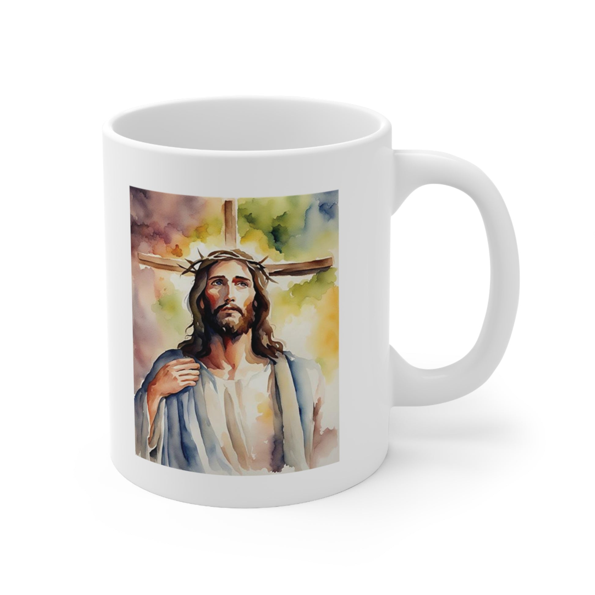 A white ceramic coffee mug with a watercolour painting of Jesus Christ standing in front of a cross