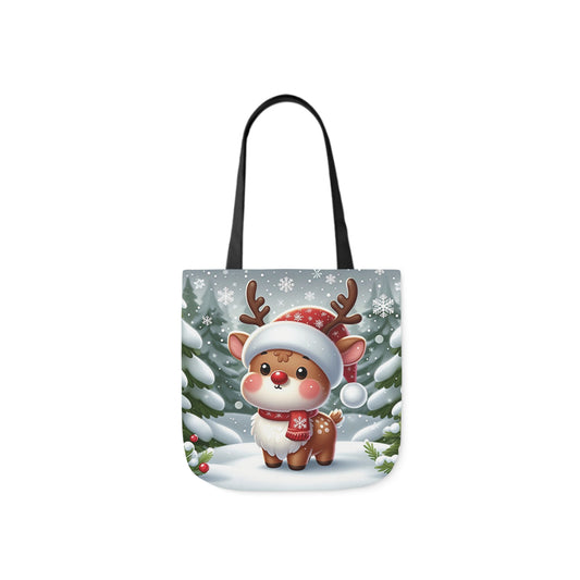 A canvas shoulder tote bag with a design of a cute reindeer in a snowy forest.