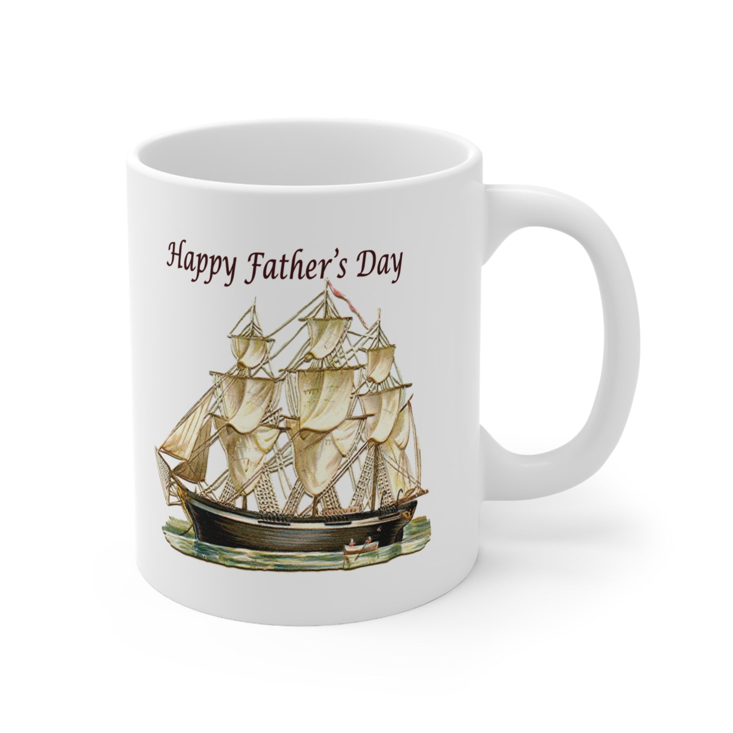 A white ceramic coffee mug with a design of a classic tall ship and the greeting Happy Father's day above it.