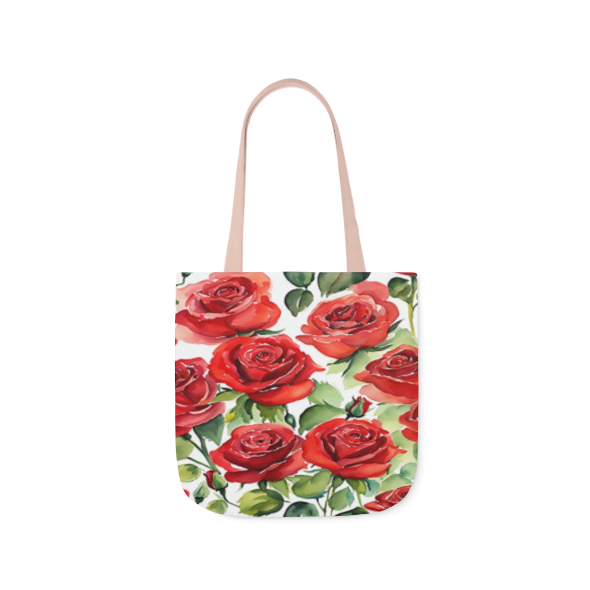 A canvas tote bag with large red roses pattern painted in watercolours. The tote bag has light pink handles.