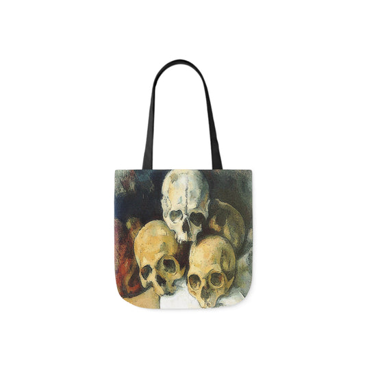 A canvas shoulder tote bag with a design of a classical painting of a pyramid of skulls painting.