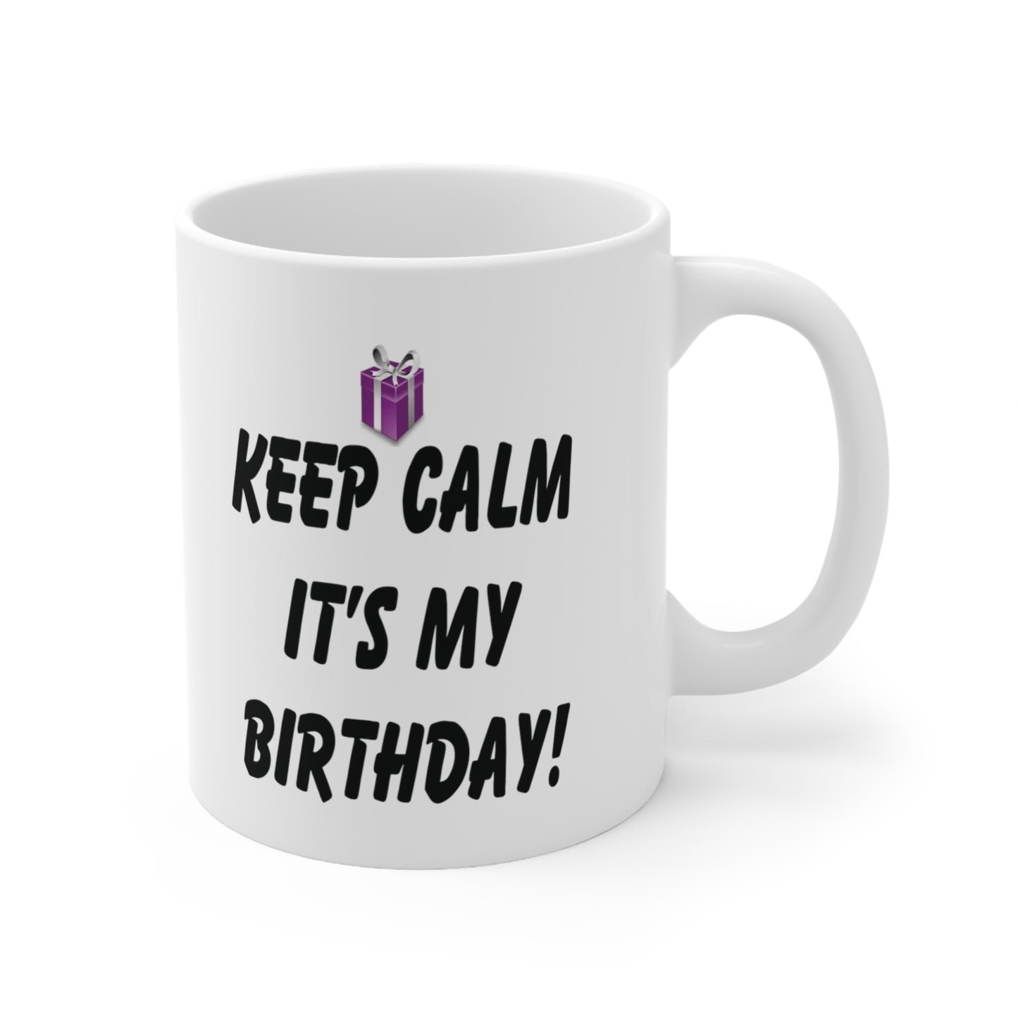 A white ceramic coffee mug with a design of a purple gift present and the quote: Keep Calm It's My Birthday!