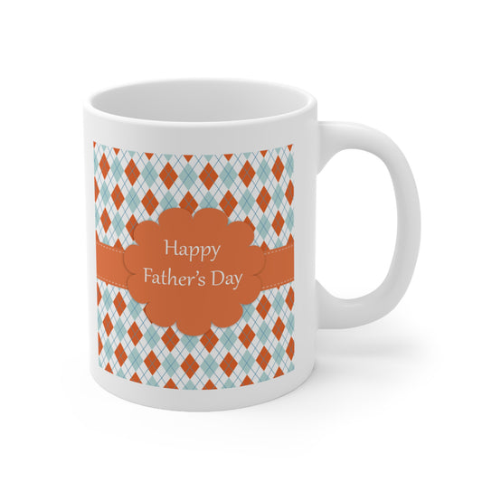 A white ceramic coffee mug with a design of blue, white and peach argyle pattern with Happy Father's day greeting in the middle.