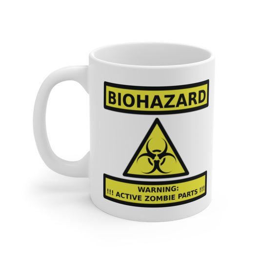 A white ceramic coffee mug with a design of a zombie sign warning of Biohazard. Warning: Active Zombie Parts!!!