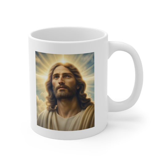 A white ceramic coffee mug with a painting of Jesus Christ shining heavenly light