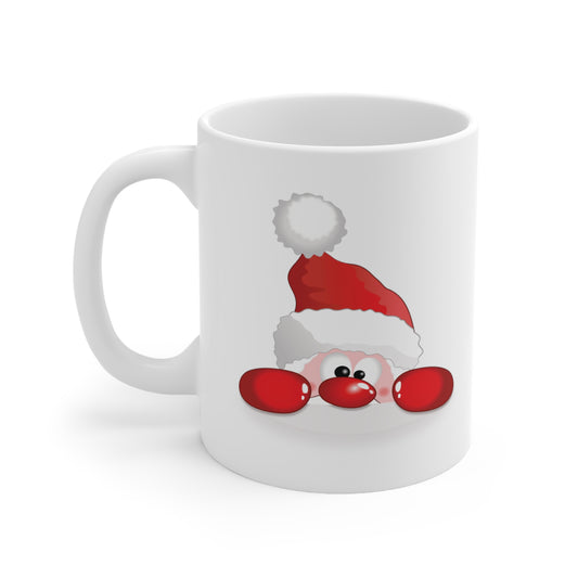 A white ceramic coffee mug with a design of a cute cartoon Santa Claus peeking over the edge to see you.