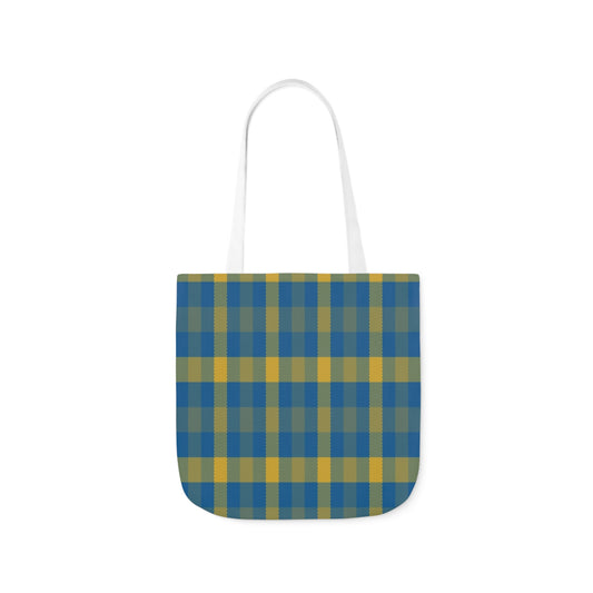 A canvas tote bag with a blue and yellow tartan pattern and white handles.