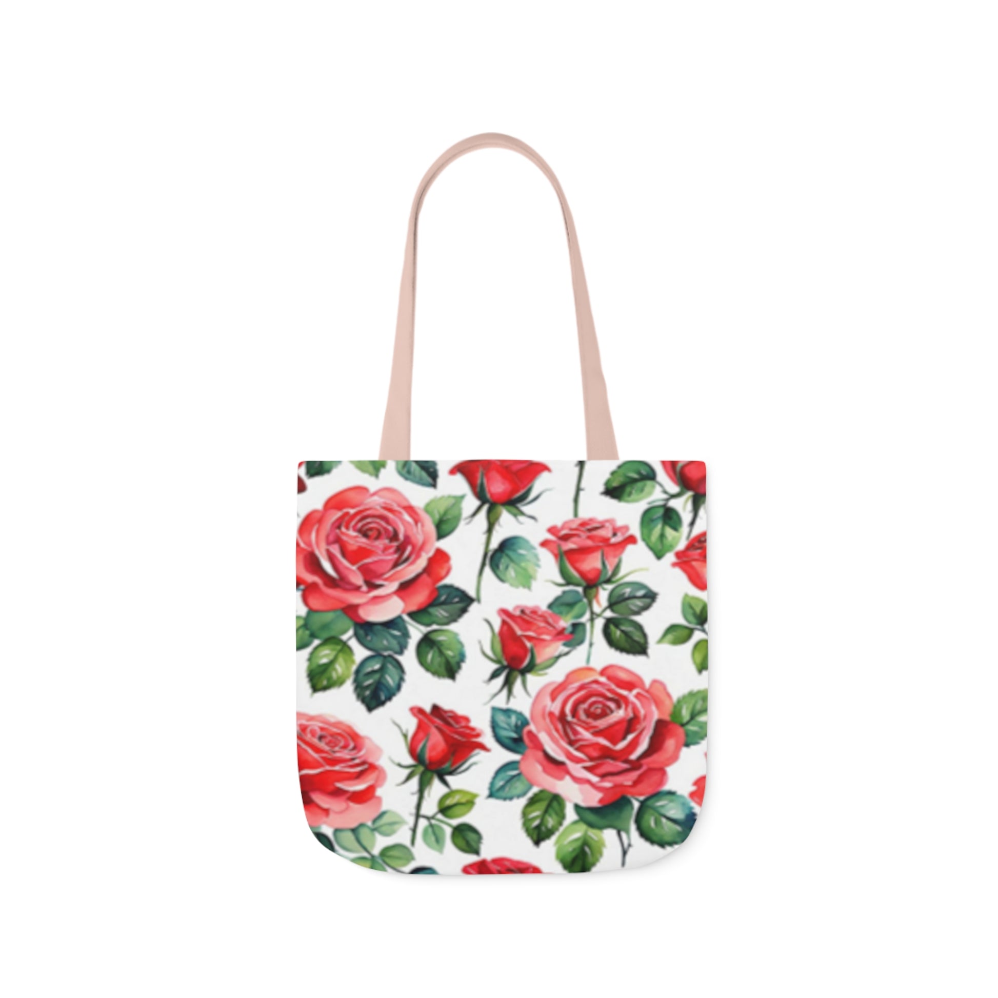 A canvas tote bag with large pink roses pattern painted in watercolour. The tote bag has light pink handles.