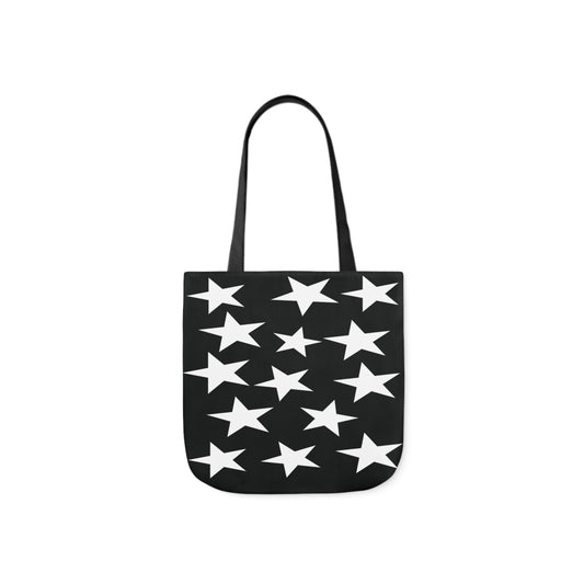 A canvas shoulder tote bag with a design of white star pattern on a black background.