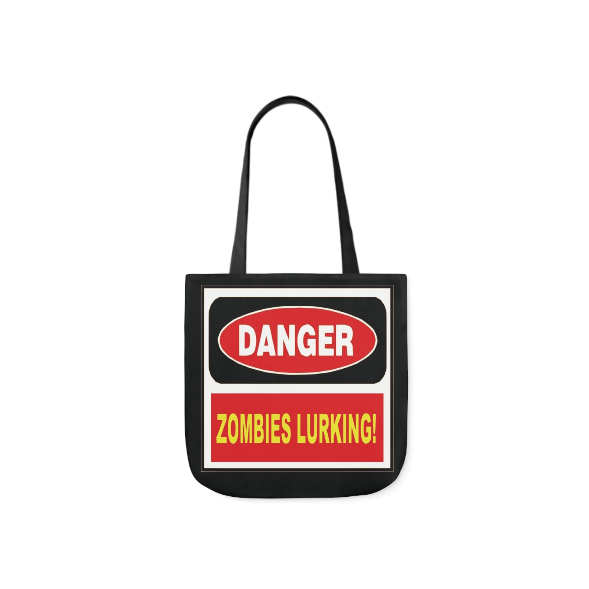 A canvas shoulder tote bag with a design of a Warning sign saying: Danger - Zombies Lurking!