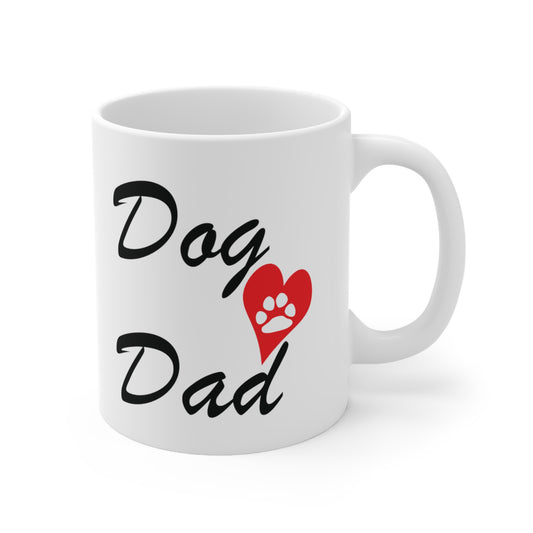 A white ceramic coffee mug with a design of Dog dad with a red heart that has a white paw print inside it.