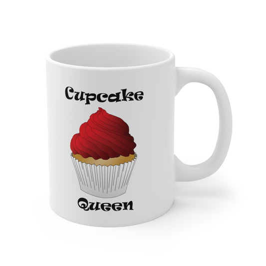 A ceramic coffee mug with a design of a cupcake and the words Cupcake Queen.