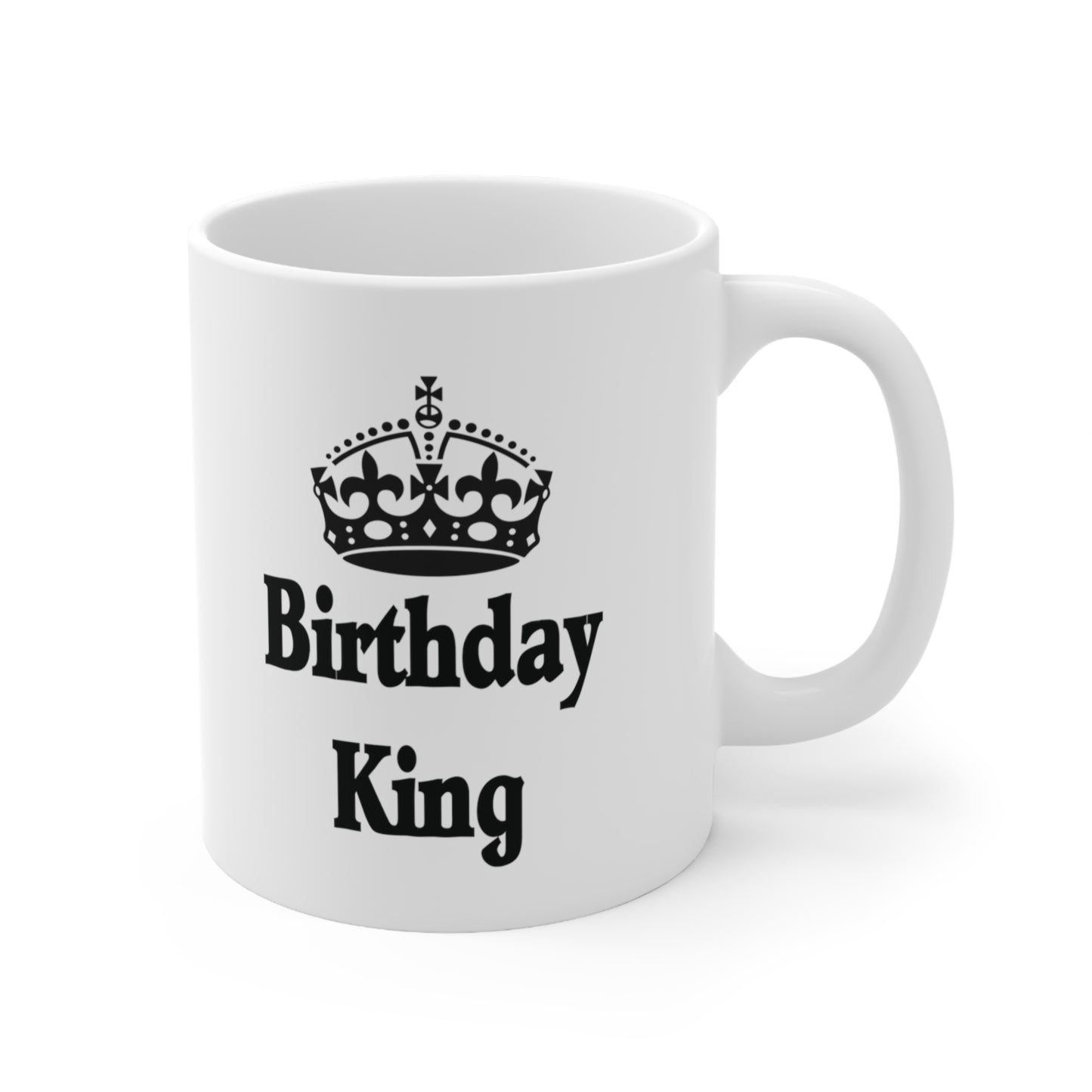 A white ceramic coffee mug with a design of a crown and the words: Birthday King underneath 