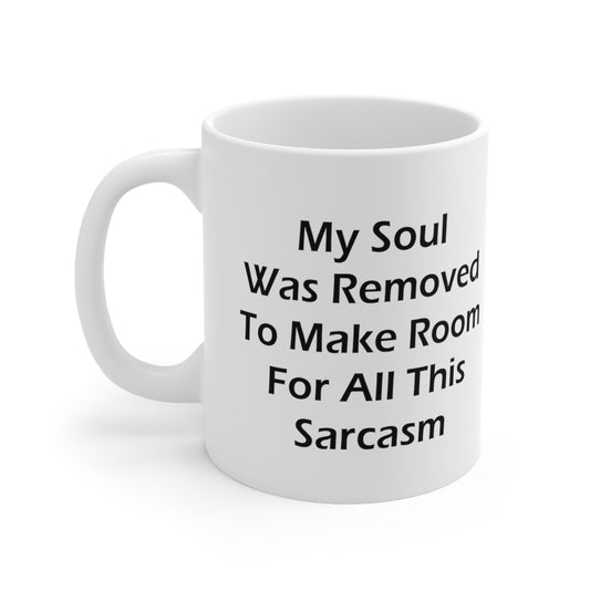A white ceramic coffee mug with the funny quote: My Soul Was Removed To Make Room For All This Sarcasm