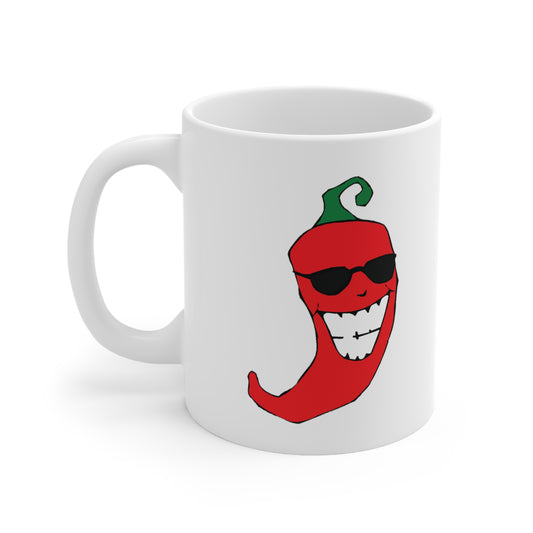 A white ceramic coffee mug with a design of a cartoon red chili pepper wearing sunglasses.
