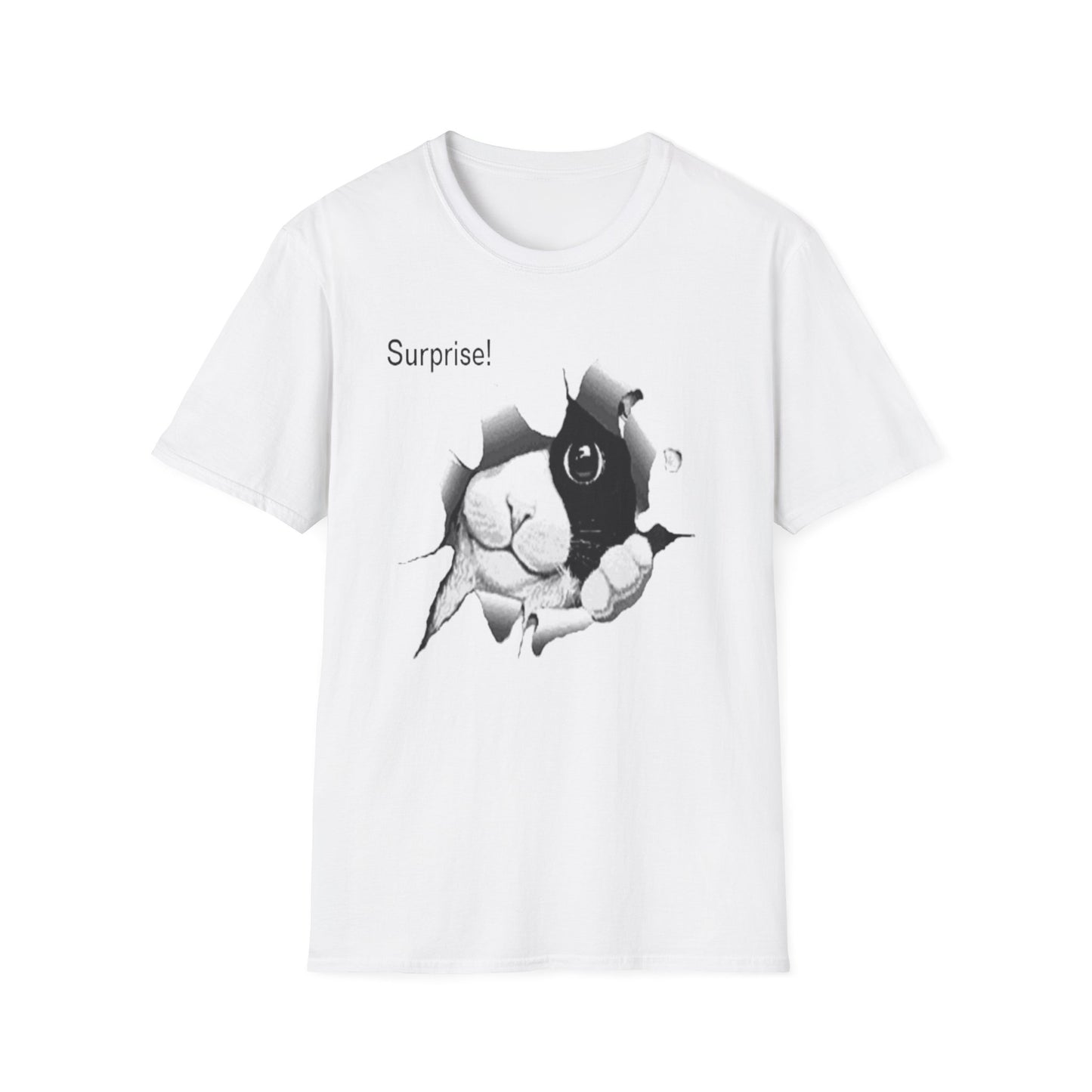 A white t-shirt with a design of a black and white cat that has ripped a hole in the shirt and is peeping through. Surprise! is written to the top left.