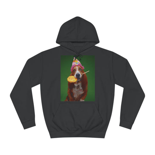 A black hoodie sweatshirt with a design of a photo of a Basset hound dog wearing a birthday party hat and holding a lollipop in her mouth.