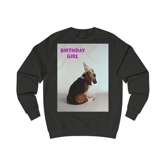 A black sweatshirt with a photo of a basset hound dog wearing a party hat. In the top left corner the words read: Birthday Girl