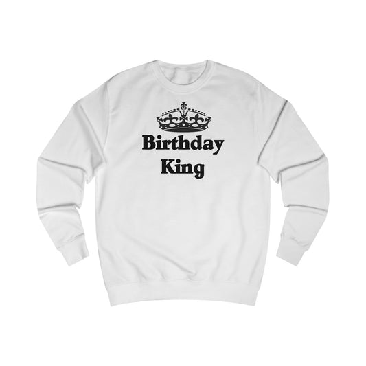 A white sweatshirt with a design of a crown and the words: Birthday King underneath