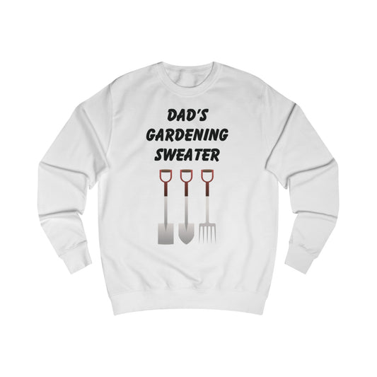 A white sweatshirt with a design of gardening tools and the words Dad's Gardening Sweater above them.