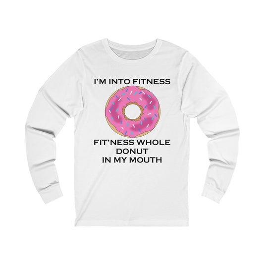 A white jersey long sleeve t-shirt with a design of a donut with pink icing and a funny quote: I'm Into fitness, Fit'ness Whole Donut In My Mouth