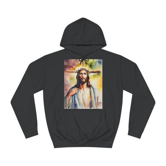 A black hoodie sweatshirt with a design of Jesus Christ standing in front of a cross. It is a watercolour painting.